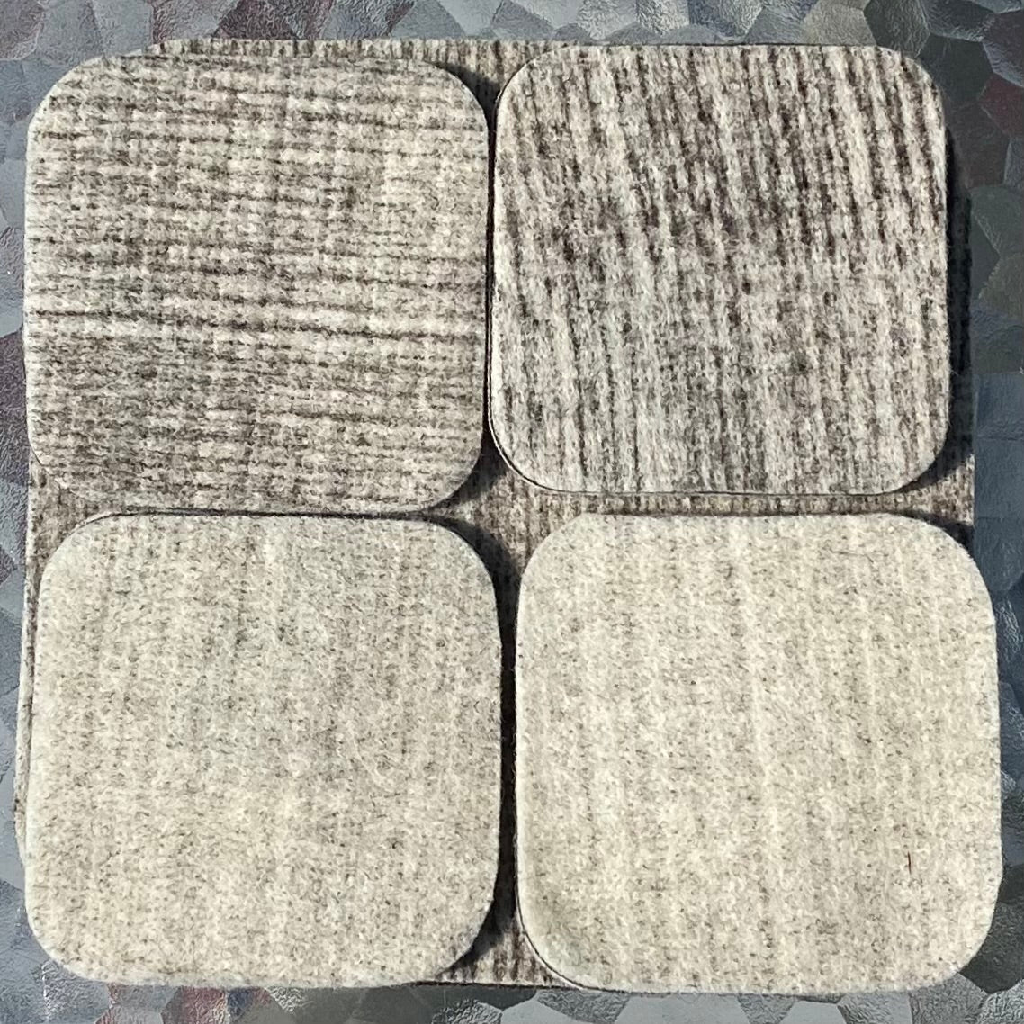 Natural & brown coasters shown. One side is natually lighter than the other due to the needle felting process. Coasters are reversible. 100% Devilsbliss Farm wool. 